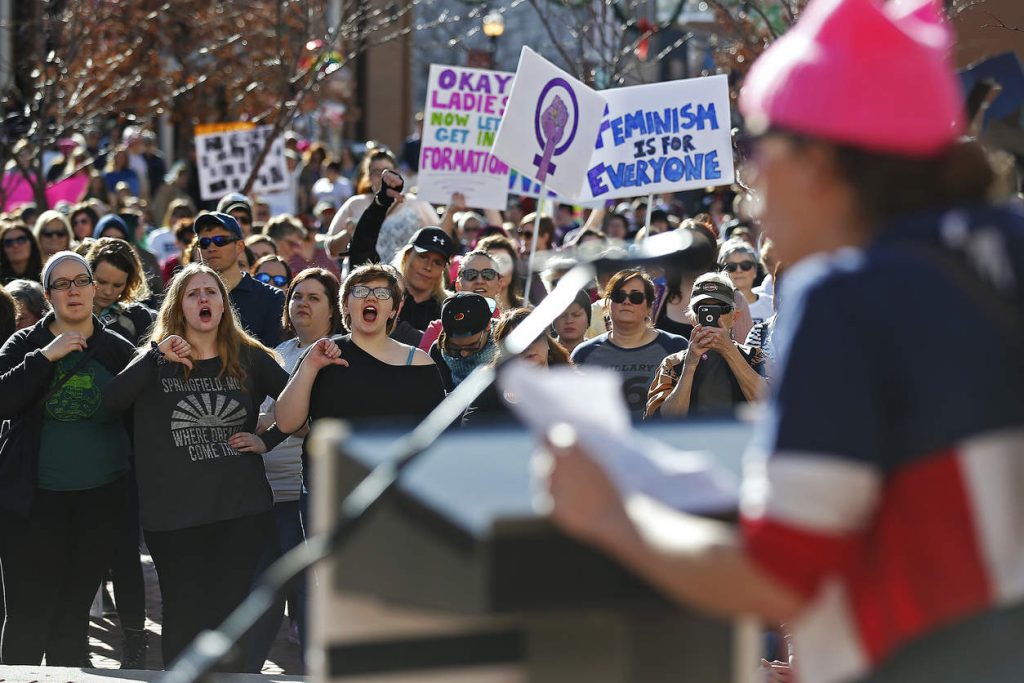 Attendees react to a speech by Bethany Johnson during the rally portion of the Women's March on Springfield at Park Central Square in Springfield, Mo. on Jan. 21, 2017. The march was one of many protests nationwide in opposition to President Donald Trump's policies on the day after his inauguration. (Guillermo Hernandez Martinez/The Springfield News-Leader via AP) NYTCREDIT: Guillermo Hernandez Martinez/The Springfield News-Leader, via Associated Press